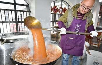 People busy producing brown sugar for festival market in China's Guizhou